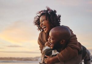 Couple smiling while learning about Ray of Hope