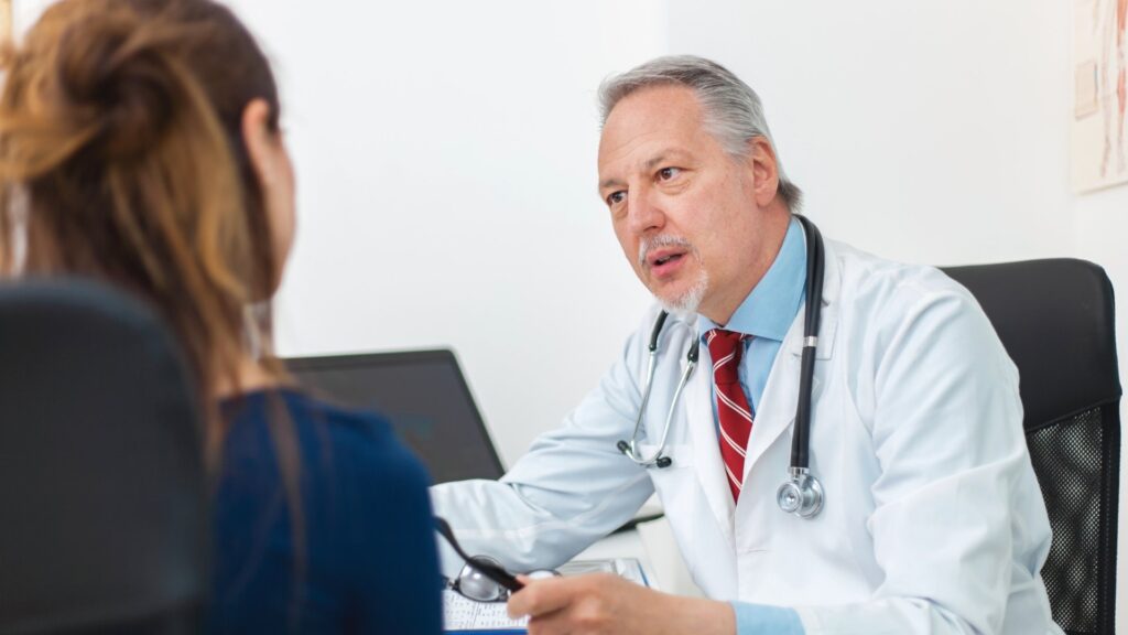 doctor talking to patient about medicaid