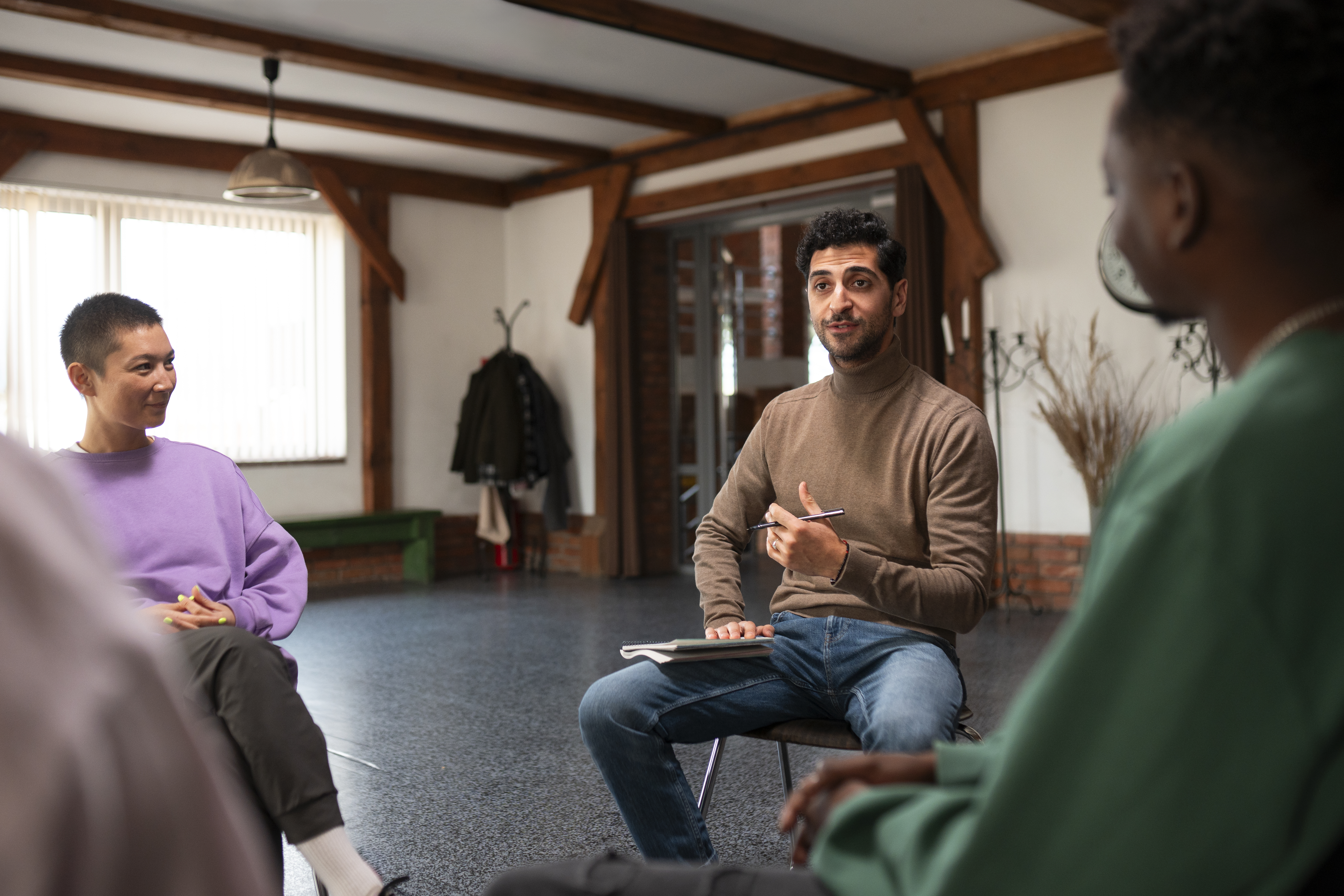 Adults participating in group therapy as part of a bipolar disorder treatment program in Columbus, Ohio