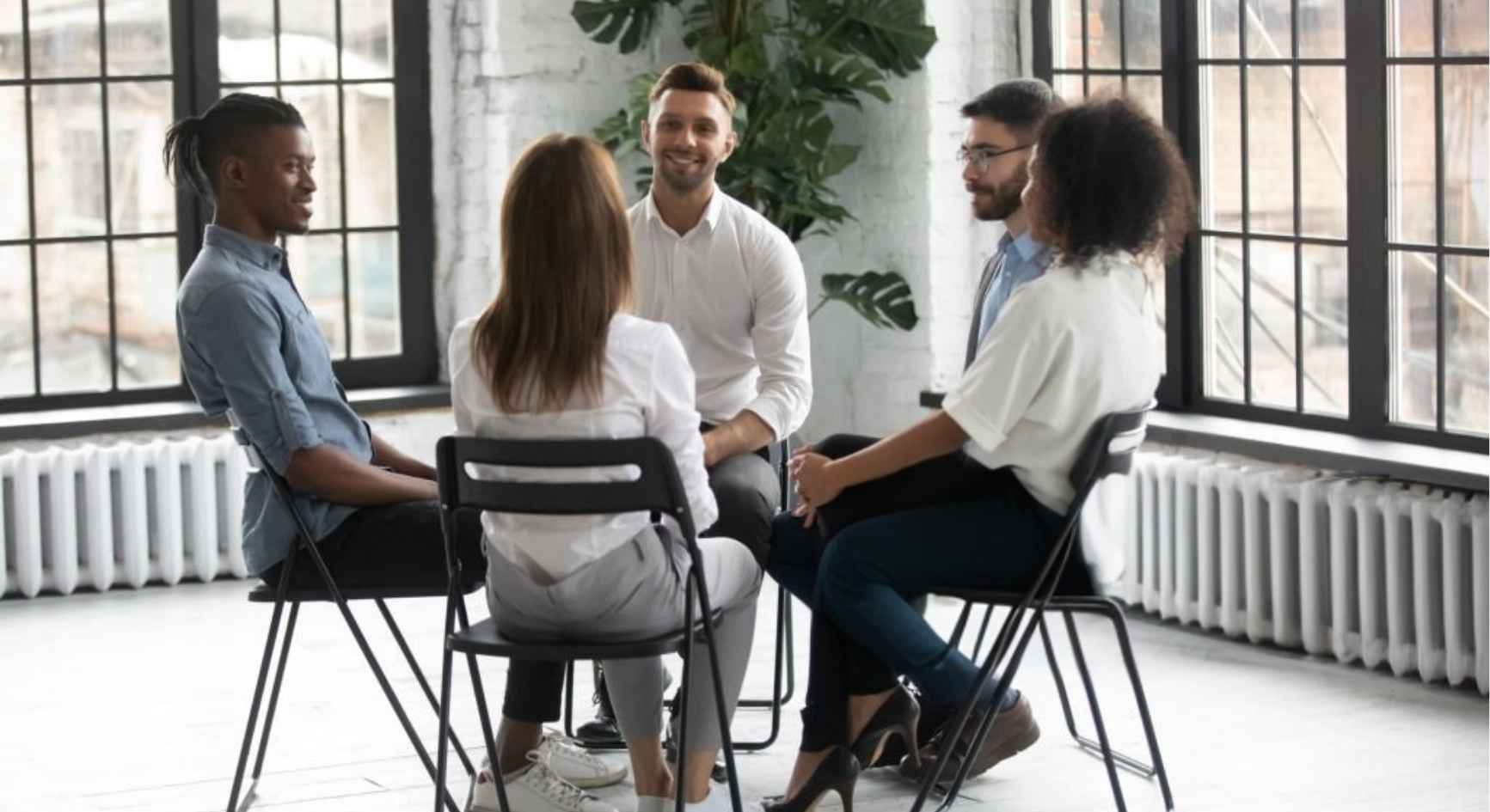 Residents in a columbus sober living peer accountability group session