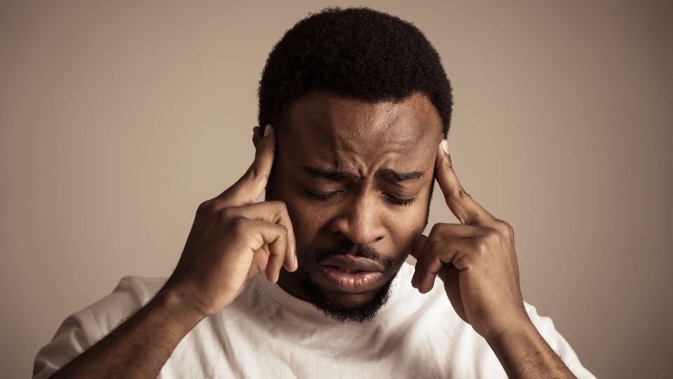 Wet Brain (Wernicke-Korsakoff Syndrome hero image of someone holding their head after the wet damage of the brain.