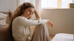 Bipolar I vs Bipolar II vs Cyclothymia hero image of a woman thinking about the differences between them.