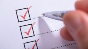 Alcohol Use Disorder Criteria hero image of check boxes on a paper.