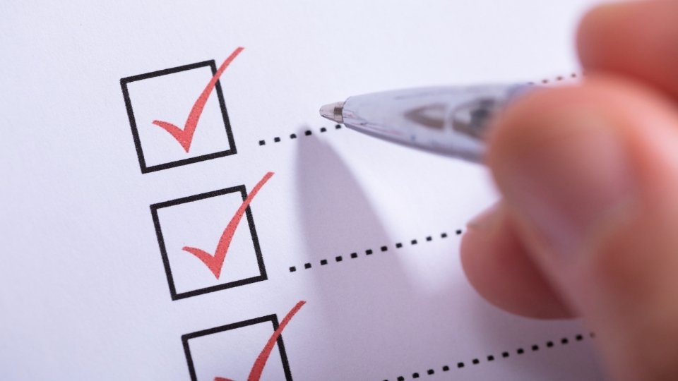 Alcohol Use Disorder Criteria hero image of check boxes on a paper.