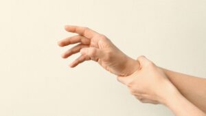 Delirium Tremens and Severe Alcohol Withdrawal hero image of a person holding their shaking hand.