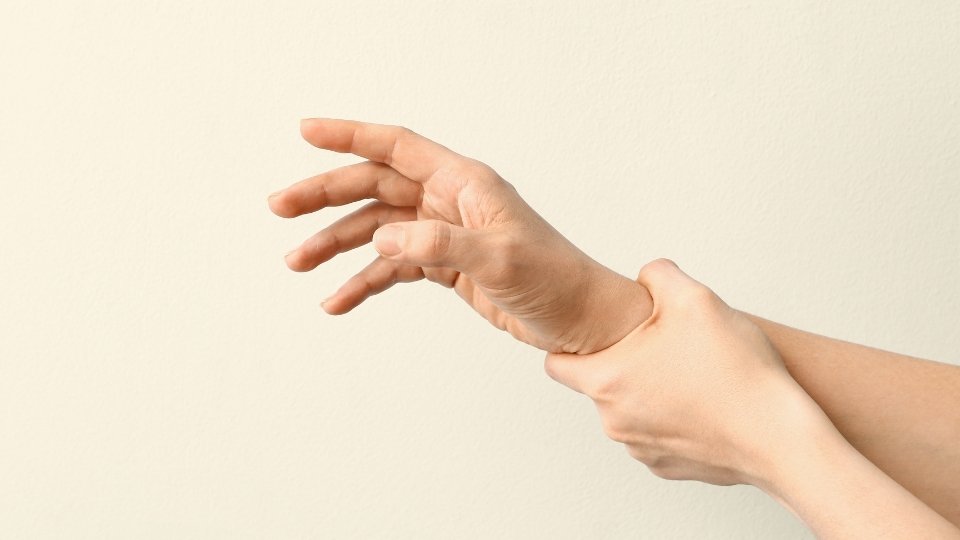 Delirium Tremens and Severe Alcohol Withdrawal hero image of a person holding their shaking hand.