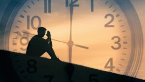 How Many Hours Is IOP hero image of a man on a hill with a clock superimposed on the image.