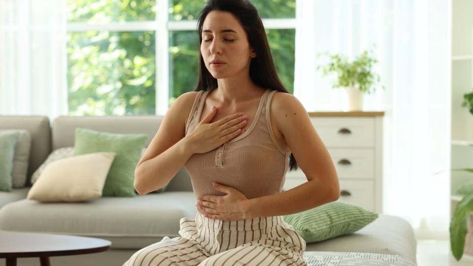 Panic Attack Physical Symptoms can include shortness of breath as this woman is demonstrating here.